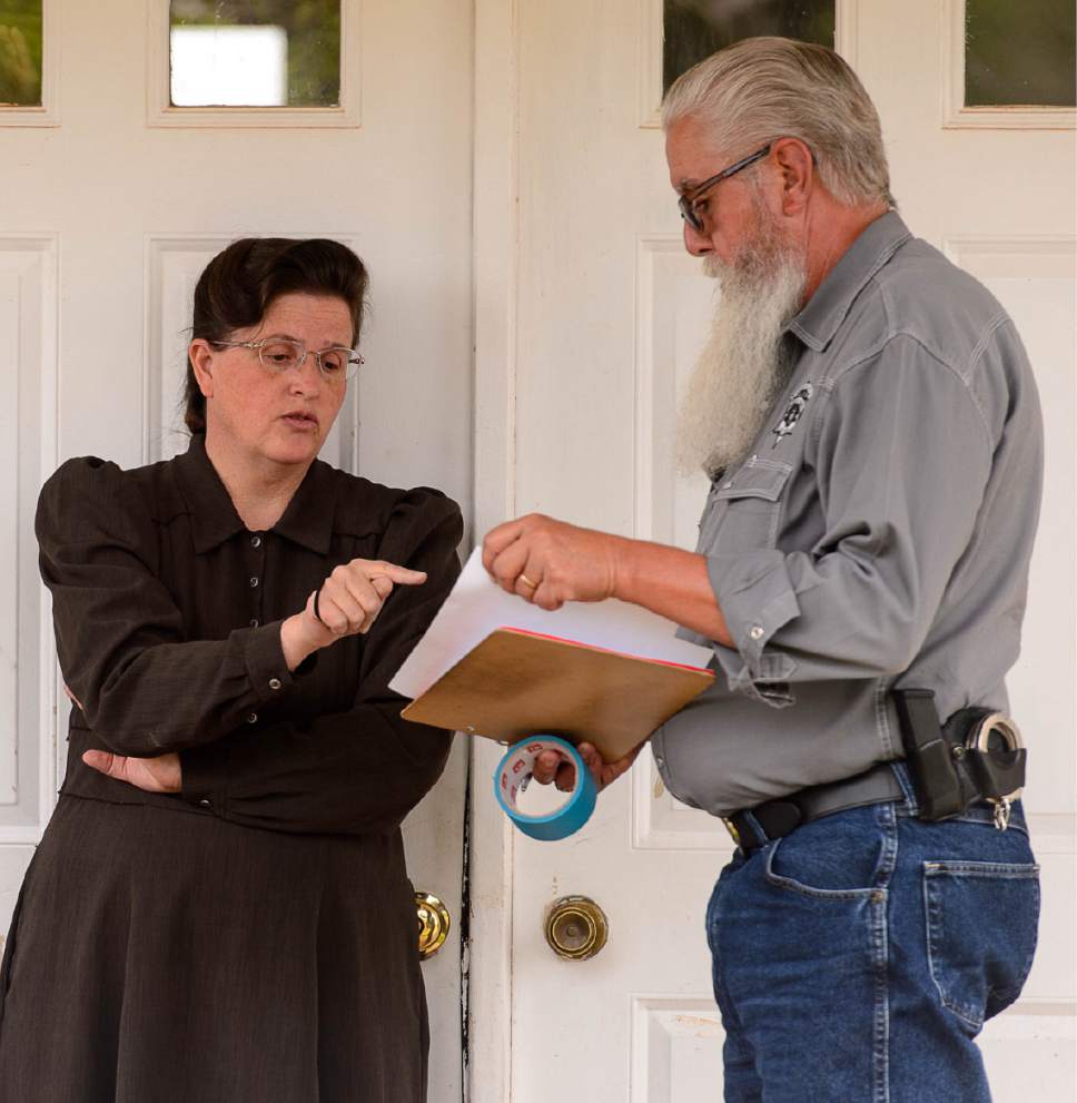 Trent Nelson  |  The Salt Lake Tribune
An FLDS woman confronts Mohave County Constable Mike Hoggard as he evicts her from a home in Colorado City, Ariz., Tuesday May 9, 2017.