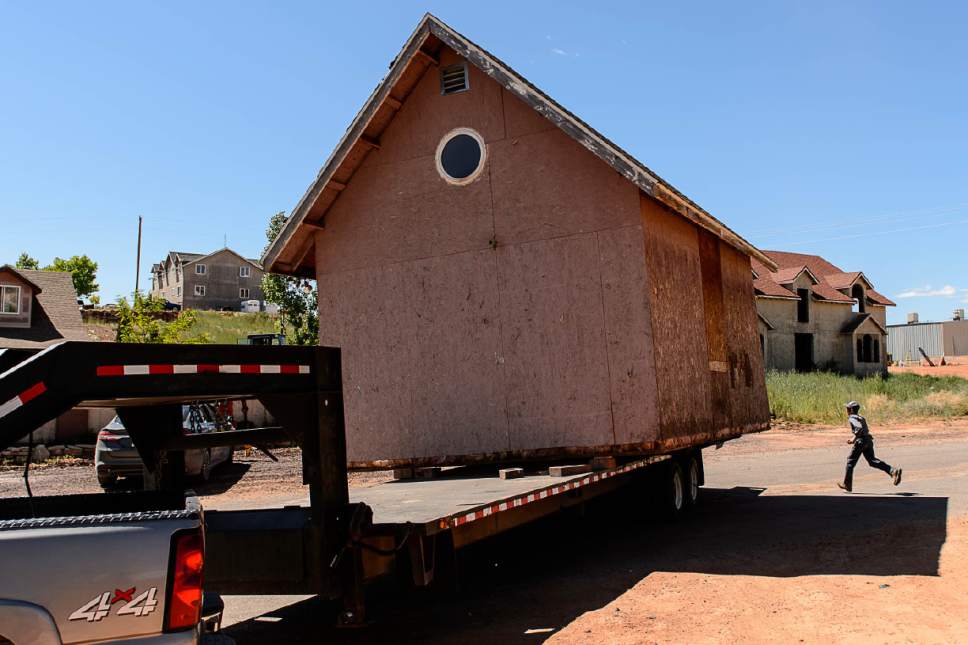 Trent Nelson  |  The Salt Lake Tribune
An FLDS boy runs as a shed is removed from a Colorado City, Ariz., property posted with a second eviction notice from the UEP Trust, Monday May 1, 2017.