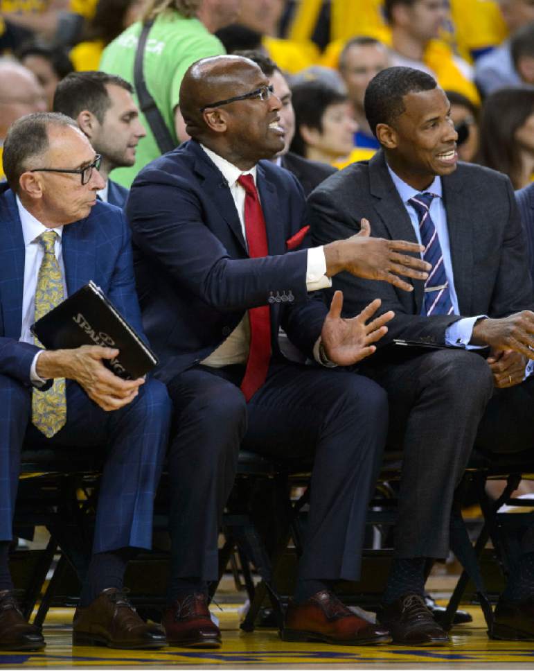 Steve Griffin  |  The Salt Lake Tribune


Acting Warriors head coach Mike Brown, center, sits with former Utah Jazz player Jarron Collins, who is also a Warrior assistant coach, during game 2 of the NBA playoff game between the Utah Jazz and the Golden State Warriors at Oracle Arena in Oakland Thursday May 4, 2017.
