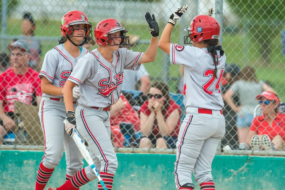 Chris Detrick  |  The Salt Lake Tribune
Spanish Fork's Mallory Barber (4) Aislyn Sharp (14) and McKell Stone (24) celebrate after scoring runs during the Class 4A softball state semifinal game at Valley Softball Complex Wednesday, May 24, 2017. Spanish Fork defeated Springville 14-0.