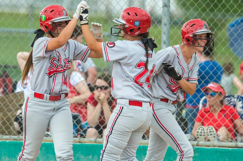 Chris Detrick  |  The Salt Lake Tribune
Spanish Fork's Mallory Barber (4) Aislyn Sharp (14) and McKell Stone (24) celebrate after scoring runs during the Class 4A softball state semifinal game at Valley Softball Complex Wednesday, May 24, 2017. Spanish Fork defeated Springville 14-0.