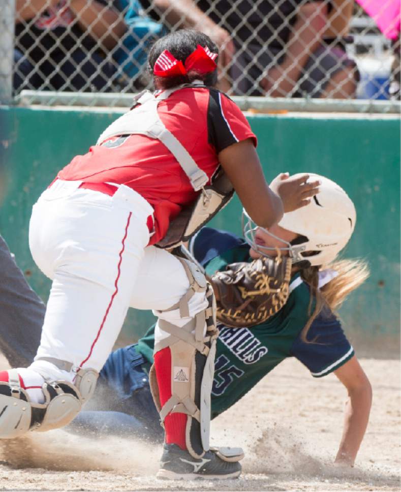Rick Egan  |  The Salt Lake Tribune

Copper Hills Kaylee Butterworth slides safely into home, in the 5A softball state semifinal game, between West and Copper Hills, in Taylorsville, Thursday, May 25, 2017.