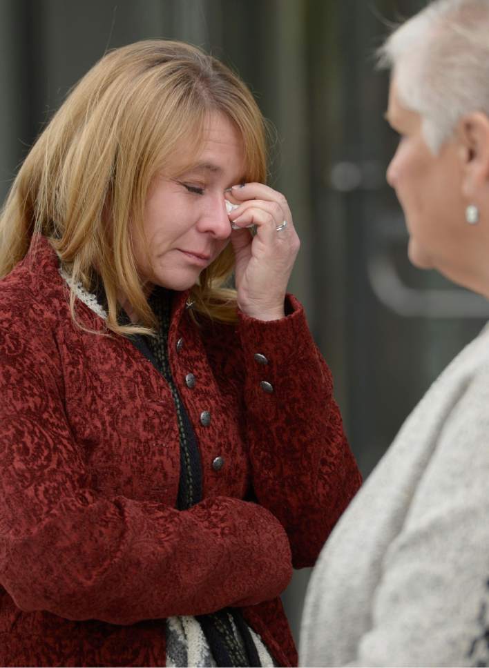 Leah Hogsten  |  The Salt Lake Tribune
The wife of Millard County Sheriff's department chief deputy wipes away tears after walking out of the Federal Courthouse in Salt Lake City after the sentencing of Roberto Miramontes Roman. Roman was sentenced to life, plus 80 years without parole for fatally shooting Millard County sheriff's Deputy Josie Greathouse Fox during a 2010 traffic stop. A jury convicted Roman in February of eight charges, including intentionally killing a local law enforcement officer engaged in the performance of official duties and using a firearm during a crime of violence.