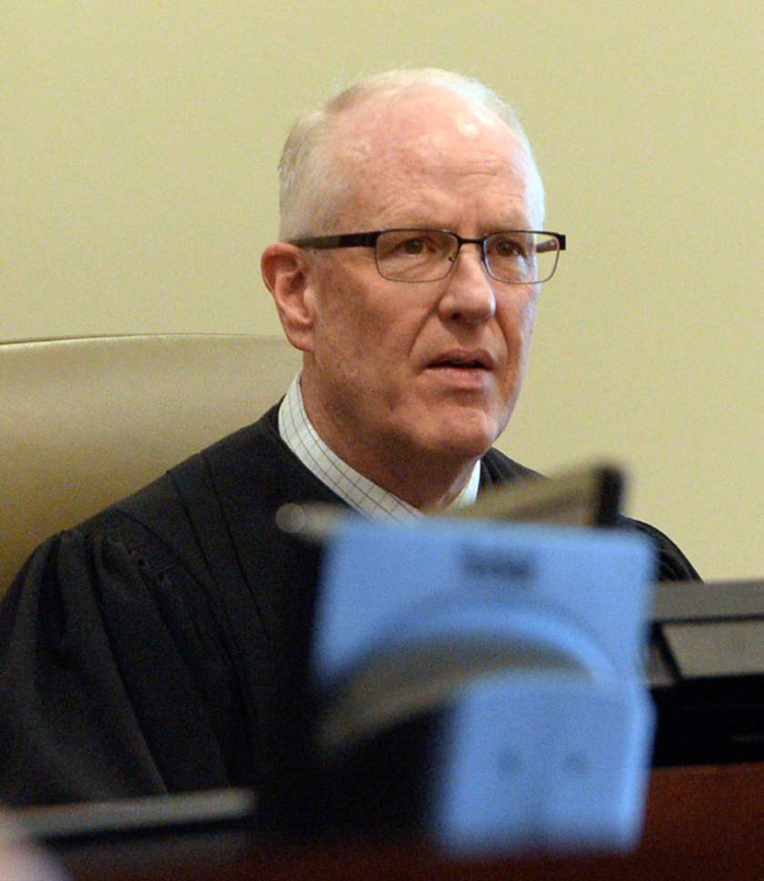 Al Hartmann  |  The Salt Lake Tribune                 
Judge Wallace Lee conducts 6th District Court in Panguitch Thursday Dec. 29 for Clay Brewer's first appearance.  Brewer, 17, of Snowflake, Arizona is being charge as an adult with first-degree-felony counts of aggravated murder, attempted aggravated murder and aggravated robbery, as well as a third-degree-felony count of failure to stop at the command of police, and misdemeanor counts of tampering with evidence, reckless endangerment, theft and reckless driving. He is accused of killing 61-year-old Jimmy Woolsey during an attack at Turn-About Ranch School, located north of Escalante.