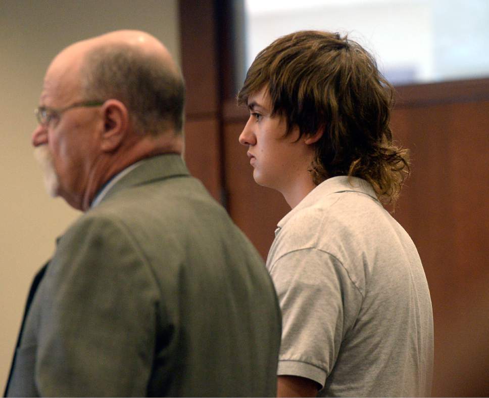 Al Hartmann  |  The Salt Lake Tribune                 
Clay Brewer, 17, of Snowflake, Arizona meets with his defense attorney Ron Yengich in Judge Wallace Lee's 6th District Court in Panguitch Thursday Dec. 29 to make his first court appearance.  He is being charge as an adult with first-degree-felony counts of aggravated murder, attempted aggravated murder and aggravated robbery, as well as a third-degree-felony count of failure to stop at the command of police, and misdemeanor counts of tampering with evidence, reckless endangerment, theft and reckless driving. He is accused of killing 61-year-old Jimmy Woolsey during an attack at Turn-About Ranch School, located north of Escalante.