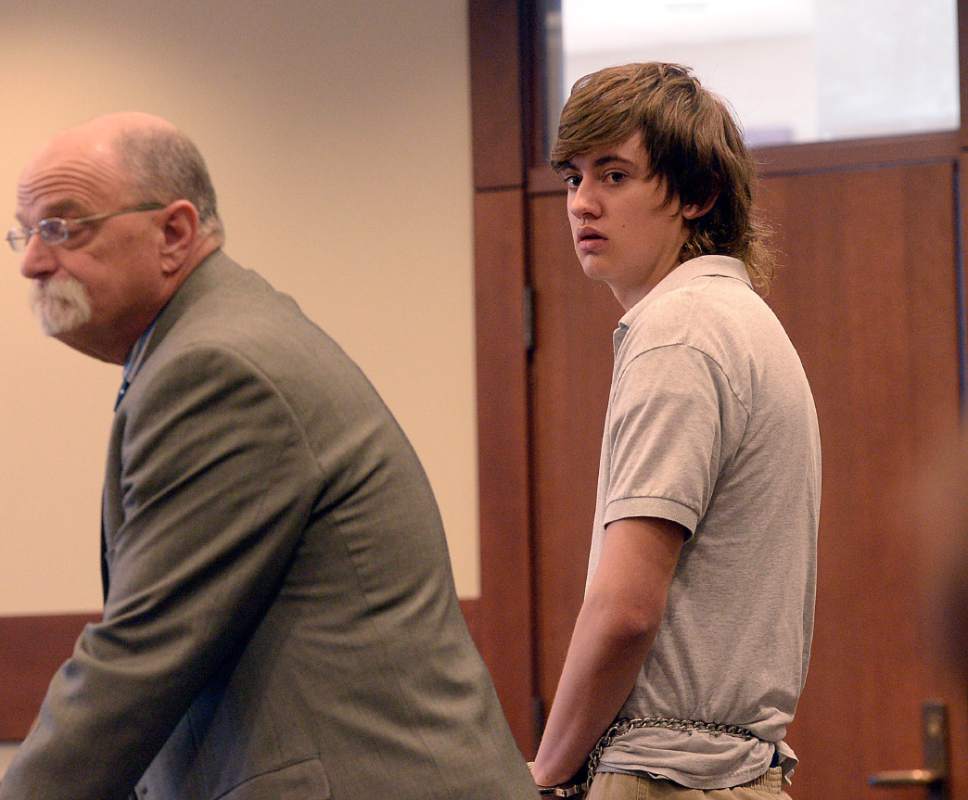 Al Hartmann  |  The Salt Lake Tribune                 
Clay Brewer, 17, of Snowflake, Arizona meets with his defense attorney Ron Yengich in Judge Wallace Lee's 6th District Court in Panguitch Thursday Dec. 29 to make his first court appearance.  He is being charge as an adult with first-degree-felony counts of aggravated murder, attempted aggravated murder and aggravated robbery, as well as a third-degree-felony count of failure to stop at the command of police, and misdemeanor counts of tampering with evidence, reckless endangerment, theft and reckless driving. He is accused of killing 61-year-old Jimmy Woolsey during an attack at Turn-About Ranch School, located north of Escalante.