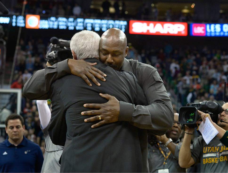 Scott Sommerdorf   |  The Salt Lake Tribune
Jazz great Karl Malone hugs his former coach Jerry Sloan after he spoke to the crowd and told Sloan how much he loved him, during halftime as the Jazz hosted the Golden State Warriors, Friday, Jan. 31, 2014.