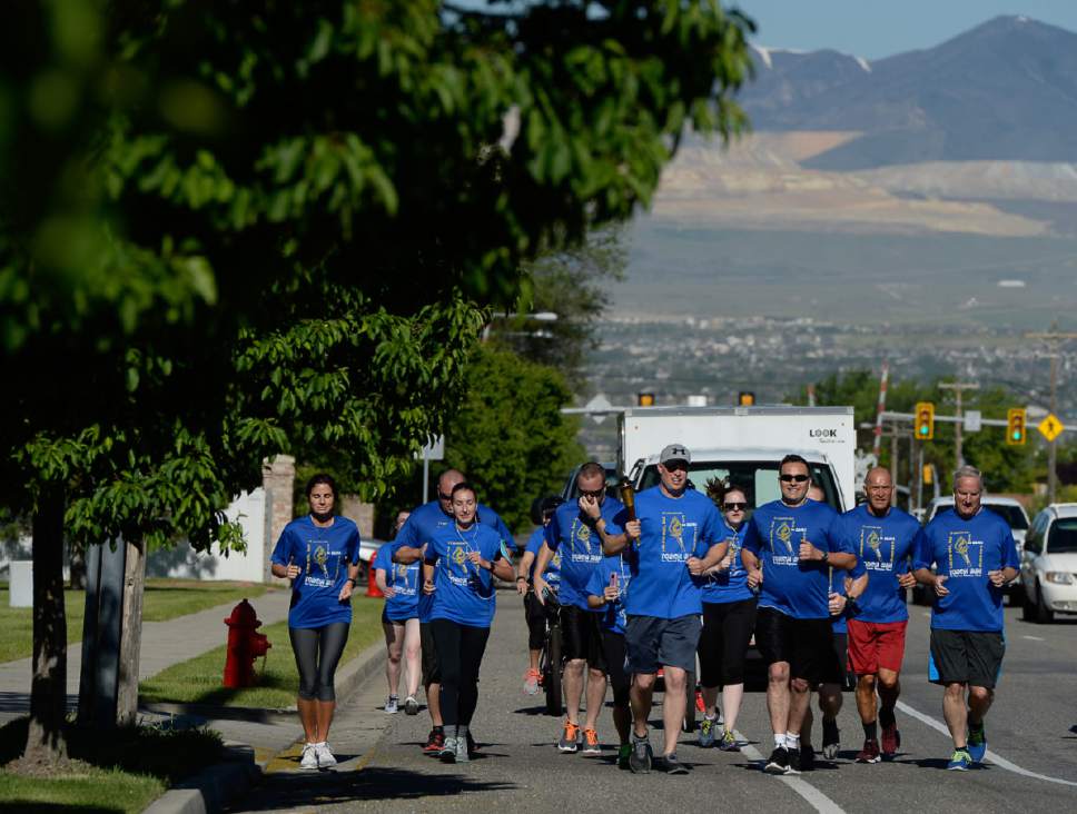 Francisco Kjolseth | The Salt Lake Tribune
Members of the Draper Police Department participate in the annual Law Enforcement Torch Run for Special Olympics Utah by carrying the "Flame of Hope" from 11400 South State Street to Draper City Hall on Wed. May 24, 2017.