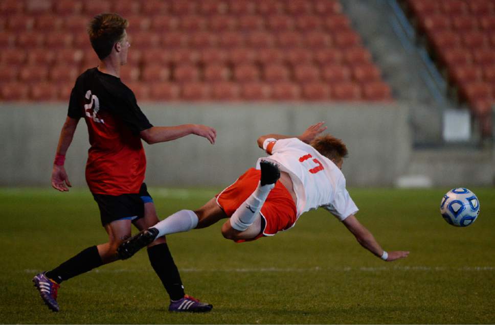 Francisco Kjolseth | The Salt Lake Tribune
Alta's Jack Anderson (22) sends Scott Christensen (17) sailing before their 1-0 win over East in 4A boys' state soccer championship at Rio Tinto Stadium, Thursday, May 25, 2017.