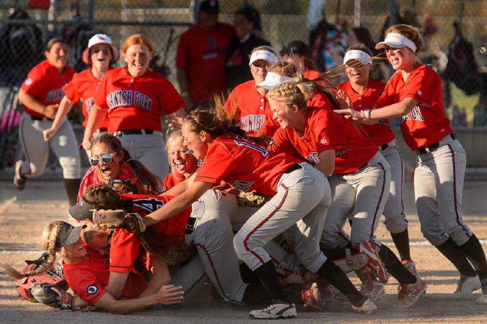 Trent Nelson  |  The Salt Lake Tribune
Spanish Fork players celebrate defeating Uintah High School in the Class 4A softball state title game in Taylorsville, Thursday May 25, 2017.
