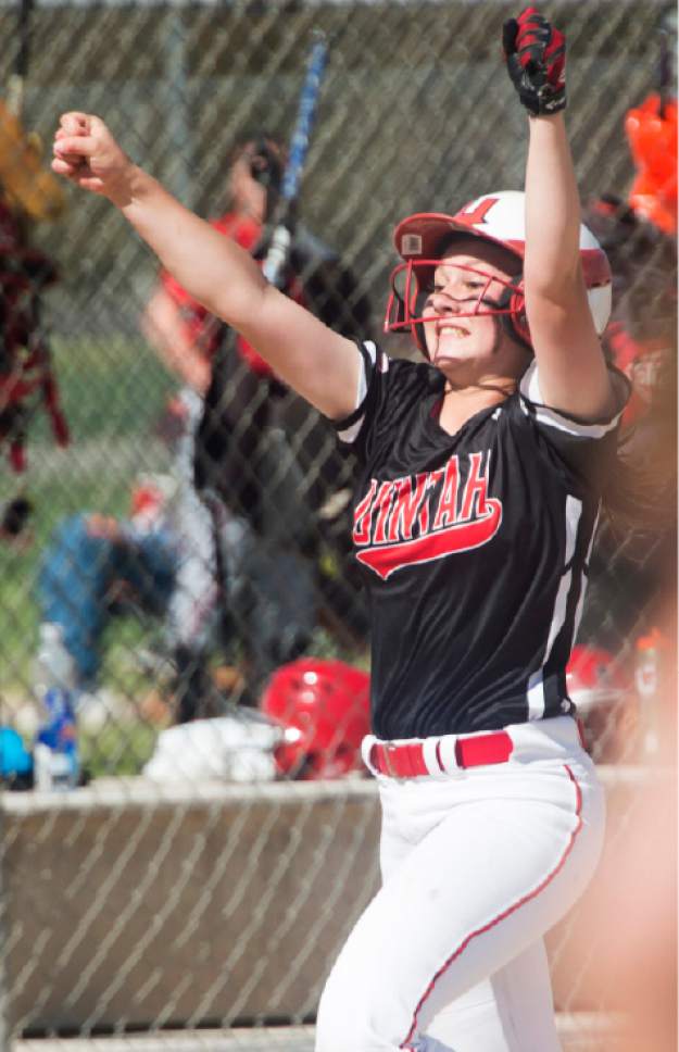 Rick Egan  |  The Salt Lake Tribune

Morgan Reynalds celebrates as she crosses home plate on a home run by Summer Stensgard, in the 4A softball state game between Spanish Fork and Uintah, in Taylorsville, Thursday, May 25, 2017.