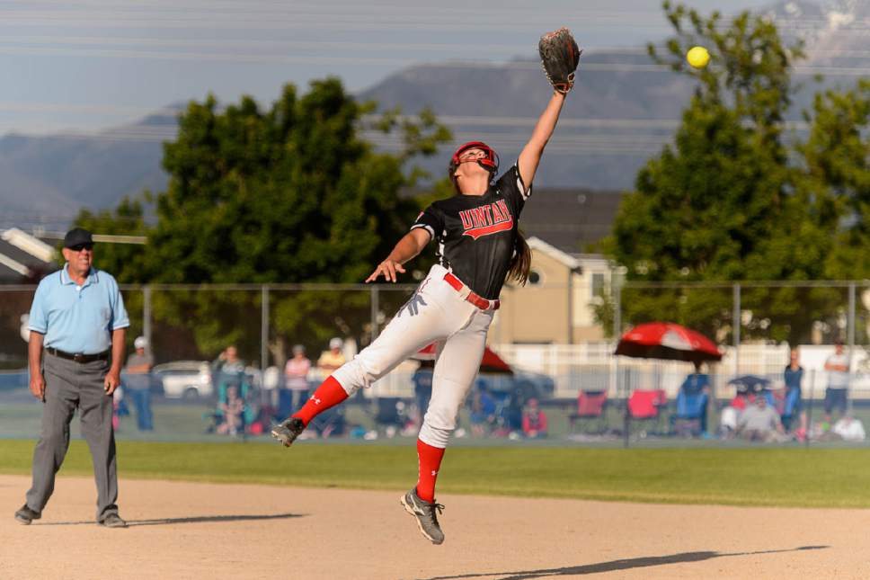 Trent Nelson  |  The Salt Lake Tribune
Uintah's Kennedy Callahan leaps for the ball as Spanish Fork defeats Uintah High School in the Class 4A softball state title game in Taylorsville, Thursday May 25, 2017.