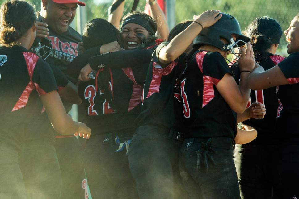 Chris Detrick  |  The Salt Lake Tribune
Members of the West softball team celebrate after West's Kensey Lopati (3) scored a run during the Class 5A softball state championship game at Valley Softball Complex Thursday, May 25, 2017. West defeated Bingham 12-6.