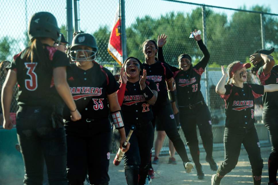 Chris Detrick  |  The Salt Lake Tribune
Members of the West softball team celebrate after West's Kensey Lopati (3) scored a run during the Class 5A softball state championship game at Valley Softball Complex Thursday, May 25, 2017. West defeated Bingham 12-6.