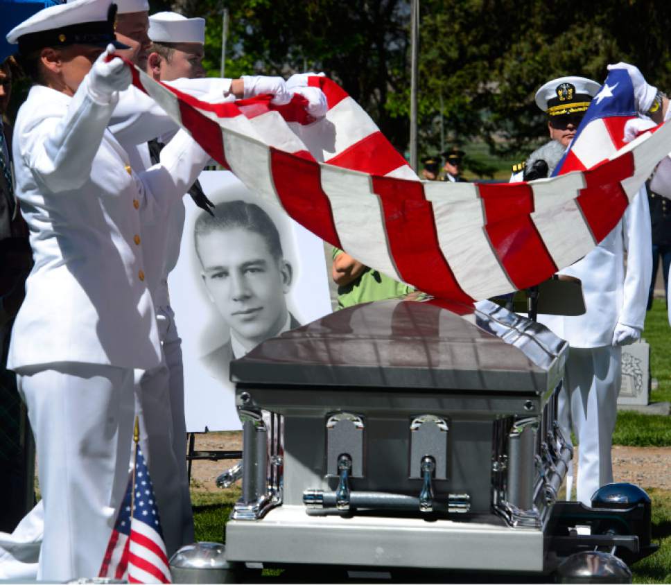 Steve Griffin  |  The Salt Lake Tribune



The Navy Honor Guard folds the the American Flag from the casket of Elliott Deen Larsen whose remains finally came home to the Monroe City Cemetery during graveside service in Monroe, Utah  Friday May 26, 2017. Larsen's family recently learned that he died on the USS Oklahoma at Pearl Harbor.