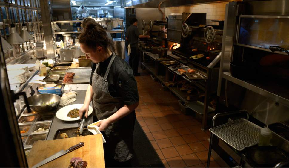 Leah Hogsten  |  The Salt Lake Tribune 
Sous chef Anna Kiceina prepares a rack of lamb plate at Firewood in Park City.