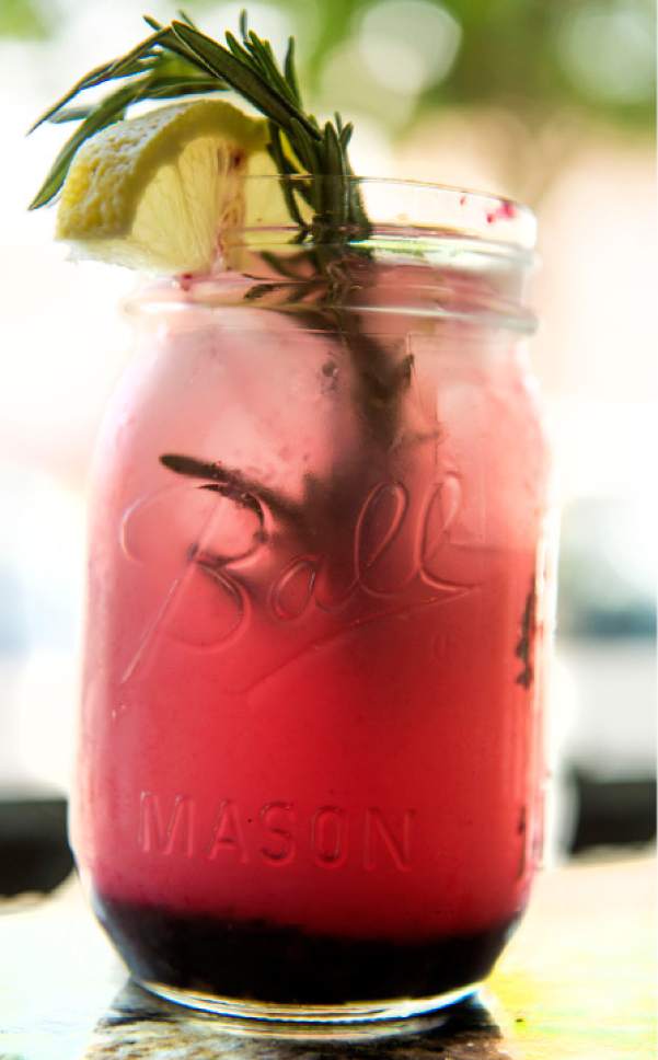 Leah Hogsten  |  The Salt Lake Tribune
The Boxcar Blew served in a Mason jar is made with white wine, lemonade, blueberry lavender jam and rosemary lemon jam, topped with rosemary and lemons, Wednesday, May 24, 2017.
Pig & A Jelly Jar, a popular Salt Lake City restaurant, opened its second location in Ogden two years ago.
