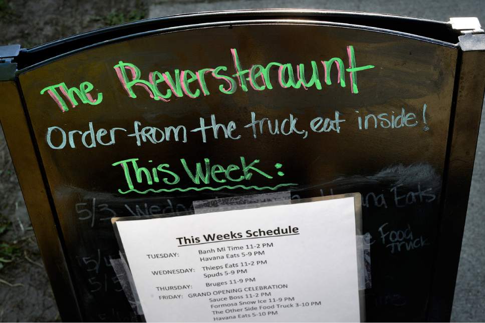 Scott Sommerdorf | The Salt Lake Tribune
The sign outside the "Reverstaurant" describing how its done,and the food truck rotations, at the Reverstaurant, Friday, May 19, 2017.