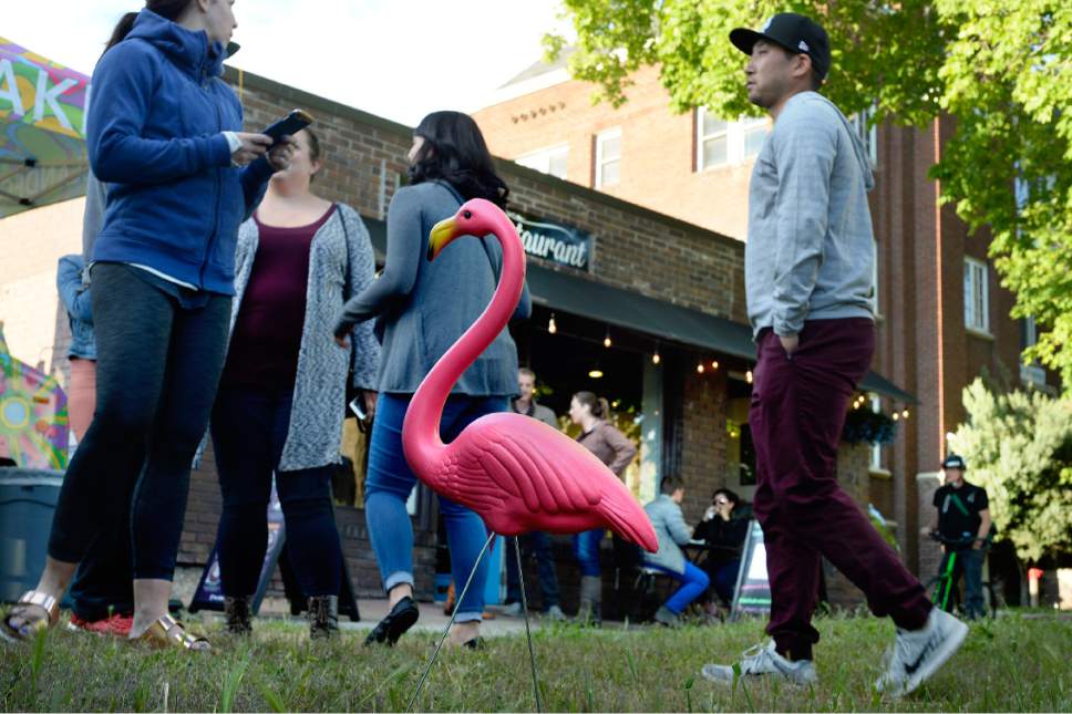 Scott Sommerdorf | The Salt Lake Tribune
People mingle near "Filipe" the flamingo, and eat on the lawn outside, as well as take their food inside at the Reverstaurant, Friday, May 19, 2017.