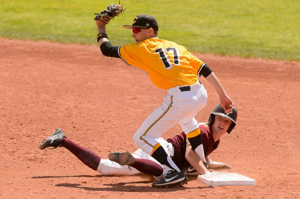 Trent Nelson  |  The Salt Lake Tribune
Cottonwood's Hunter Cornia catches Lone Peak's Tate Holmes out at second as Cottonwood beats Lone Peak High School 11-0 in the Class 5A baseball state title game in Orem, Friday May 26, 2017.