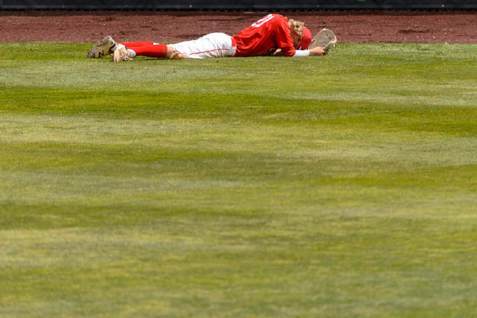 Trent Nelson  |  The Salt Lake Tribune
Spanish Fork's Brendan Bradford in right field, after a Timpanogos score, as Spanish Fork faces Timpanogos High School in the Class 4A baseball state title game in Orem, Friday May 26, 2017.