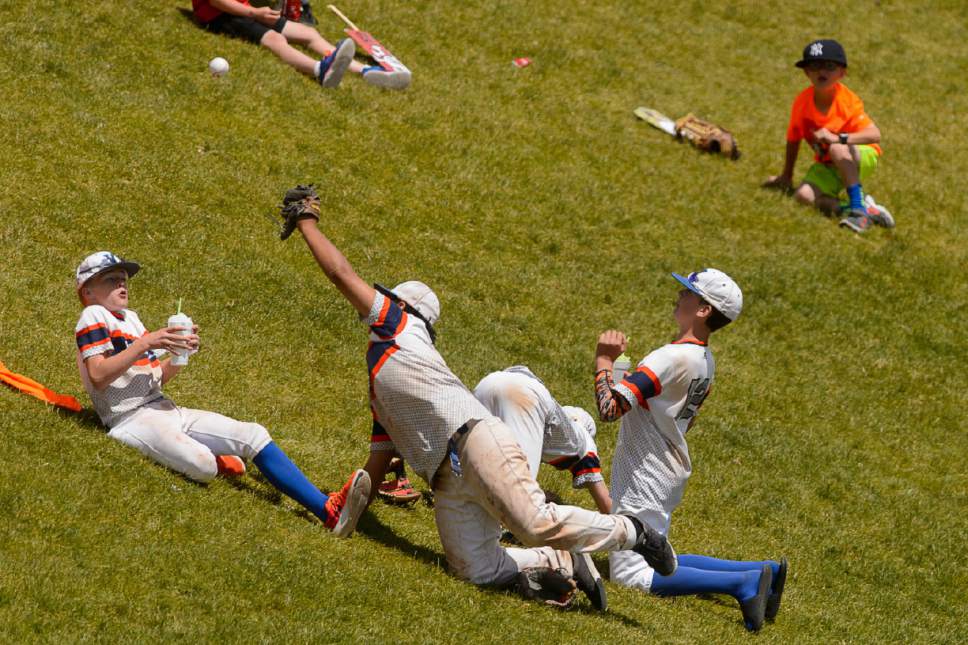 Trent Nelson  |  The Salt Lake Tribune
Fans dodge a foul ball as Spanish Fork faces Timpanogos High School in the Class 4A baseball state title game in Orem, Friday May 26, 2017.