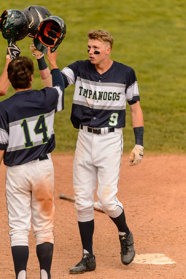 Trent Nelson  |  The Salt Lake Tribune
Timpanogos's Casey Hamilton celebrates a home run as Spanish Fork faces Timpanogos High School in the Class 4A baseball state title game in Orem, Friday May 26, 2017.