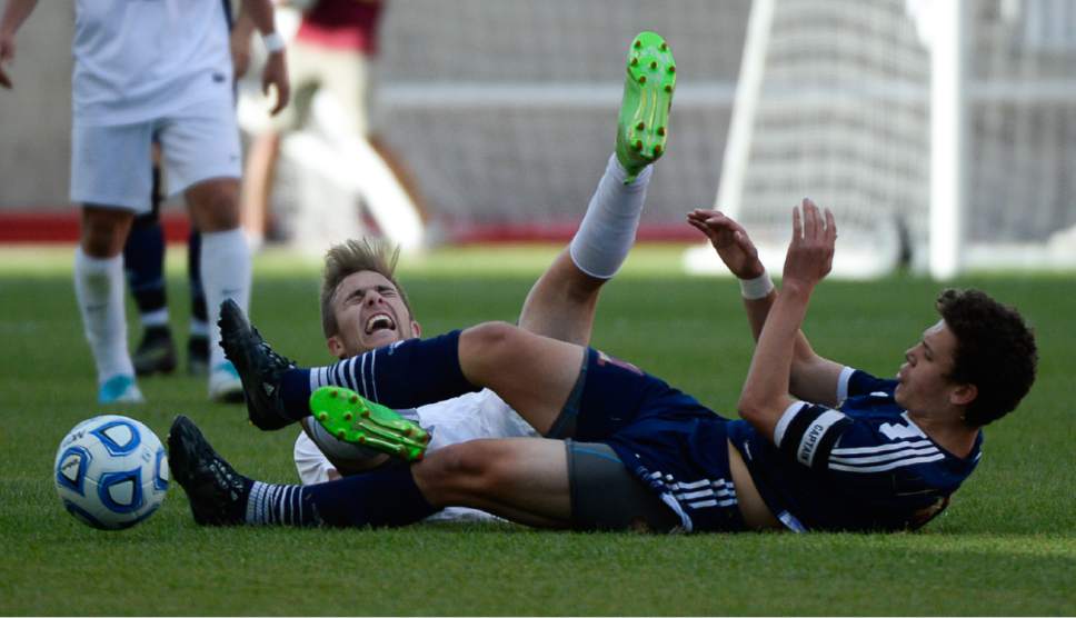 Francisco Kjolseth | The Salt Lake Tribune
Layton's Easton Embley collides with Herriman's Carter Johnson during the 5A boys' state soccer championship  at Rio Tinto Stadium, Thursday, May 25, 2017. Layton went on to win in shootout 5-3.