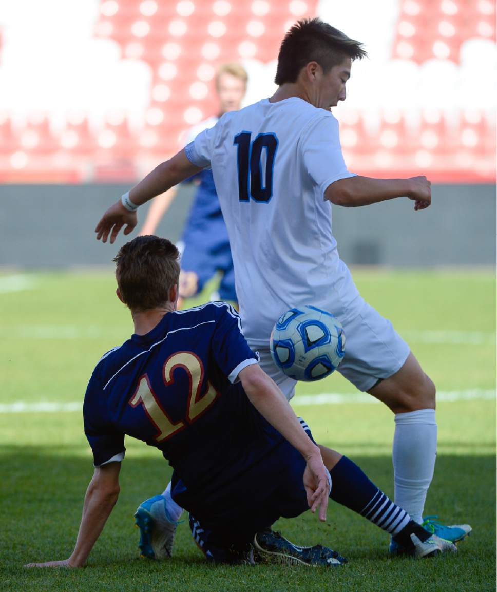 Francisco Kjolseth | The Salt Lake Tribune
Herriman's Ethan Alexander (12) gets tangled up with Kaden Amano (10) of Layton during the 5A boys' state soccer championship  at Rio Tinto Stadium, Thursday, May 25, 2017.