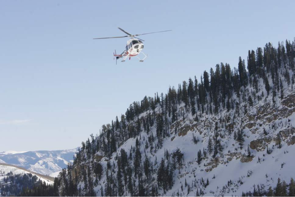 Rick Egan   |  The Salt Lake Tribune

An AirMed Helicopter flies along the peaks at Snowbird, as Wasatch Backcountry Rescue, University of Utah Health Care's AirMed and the Salt Lake County Sheriff's Office conducts a backcountry rescue training at Snowbird,Friday, January 8, 2010 Members of the Snowbird Ski Patrol, WBR and AirMed used long-range receivers (beacon locator equipment) in a simulated avalanche rescue, with the assistance of Snowbird avalanche rescue dogs.