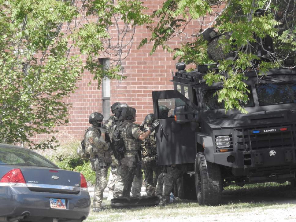 Police and SWAT team officers outside a house near 800 South and 900 West responding to a report of possible gunshots fired on Wednesday, May 24, 2017 | Photo by Chris Detrick, Salt Lake Tribune