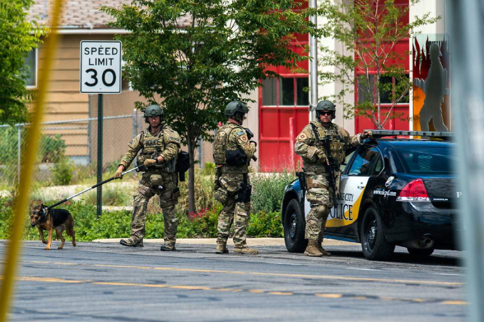 Chris Detrick  |  The Salt Lake Tribune
SWAT officers and Salt Lake Police surround a house near 800 South and 940 West Wednesday, May 24, 2017. After an hour and a half after police cordoned off an area of west Salt Lake City late Wednesday morning -- after possible gunshots were reported -- a SWAT team broke in the door of a home and found no one inside, KUTV reported.