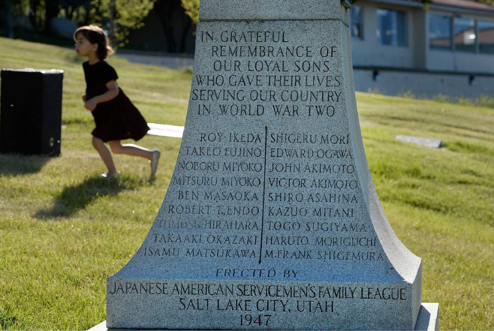 Scott Sommerdorf | The Salt Lake Tribune
A young girl runs past an obelisk memorializing the names of Japanese-American servicemen killed in World War II. The Utah Chapters of the Japanese American Citizen League on Sunday commemorated the sacrifices and honored the services of all Japanese-American veterans who have died.