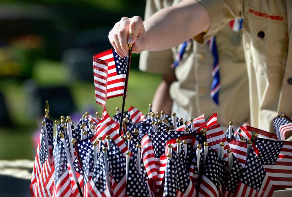 Scott Sommerdorf | The Salt Lake Tribune
Boy Scouts from Troop 1440, Dai Ichi Ward, assist placing flags representing Utah's Japanese-American servicemen killed in World War II. The Utah Chapters of the Japanese American Citizen League on Sunday commemorated the sacrifices and honored the services of all Japanese-American veterans who have died.