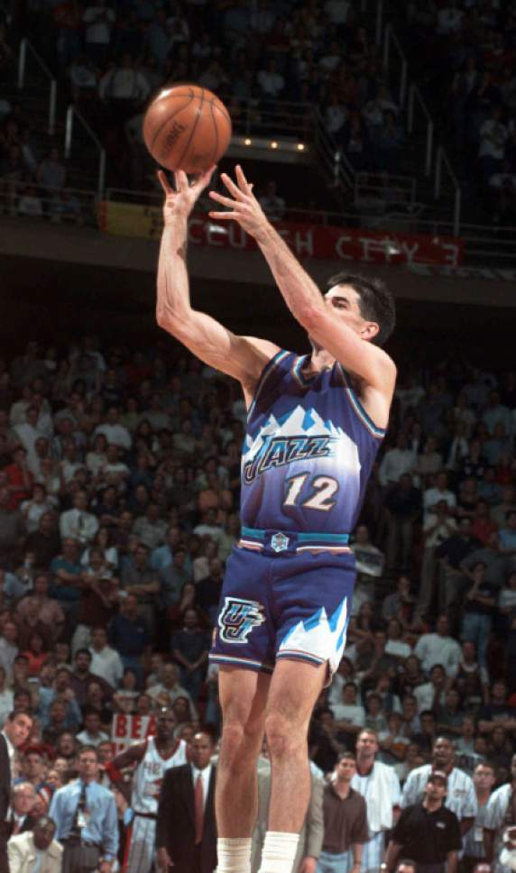 Utah Jazz's John Stockton (12) sinks a three-point shot at the buzzer to beat the Houston Rockets 103-100 in Game 6 of the Western Conference Finals Thursday, May 29, 1997, in Houston. The Jazz advance to The NBA Finals to play the Chicago Bulls. (AP Photo/Pat Sullivan)
