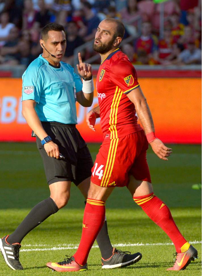 Leah Hogsten  |  The Salt Lake Tribune
The referee has words for Real Salt Lake forward Yura Movsisyan (14). Real Salt Lake is tied 1-1with the Colorado Rapids during their Rocky Mountain Championship Cup game at Rio Tinto Stadium Friday, August 26, 2016.
