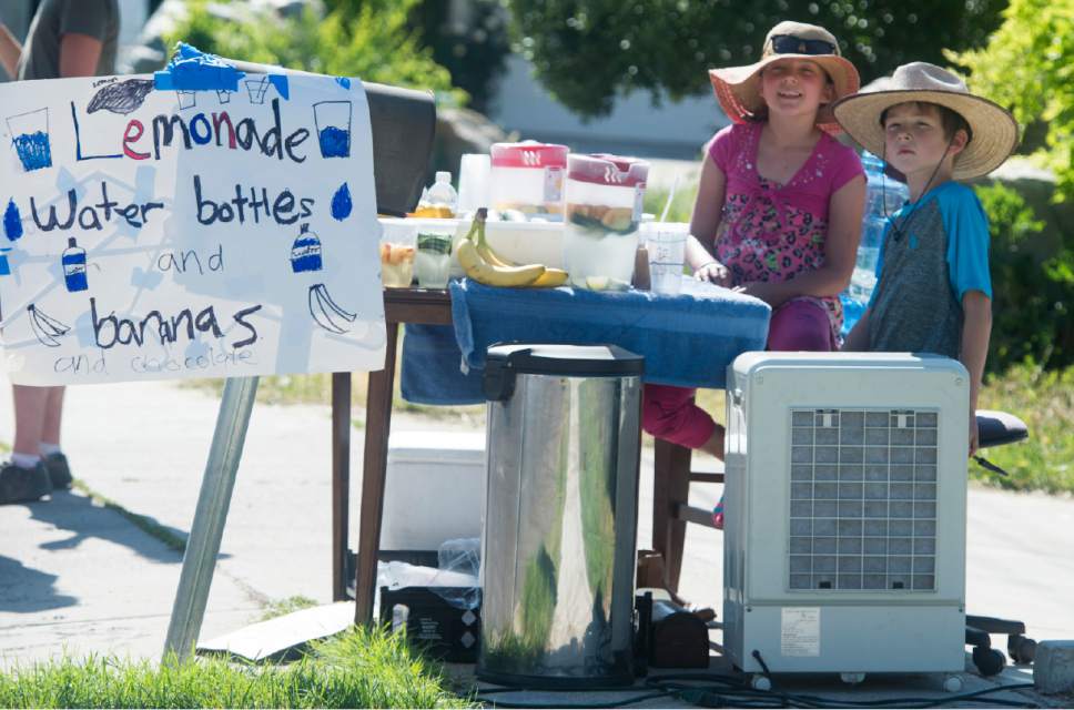 Rick Egan  |  The Salt Lake Tribune

Aurora Steed, 10, sells lemonade, water and banana's  with her 8-year old brother John, in front of their home in Provo, Tuesday, May 30, 2017.