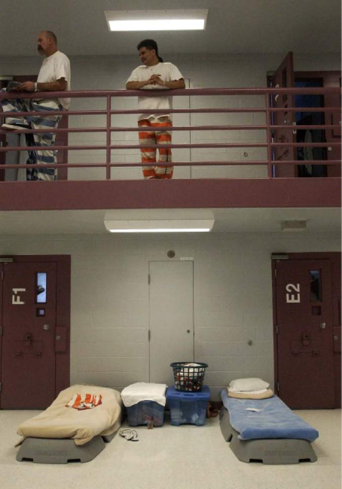 Tribune file photo
Makeshift mobile beds are placed in pod E's commons area at the Davis County Jail. Inmates who must use them say they never get any privacy in Dec. 18, 2002.