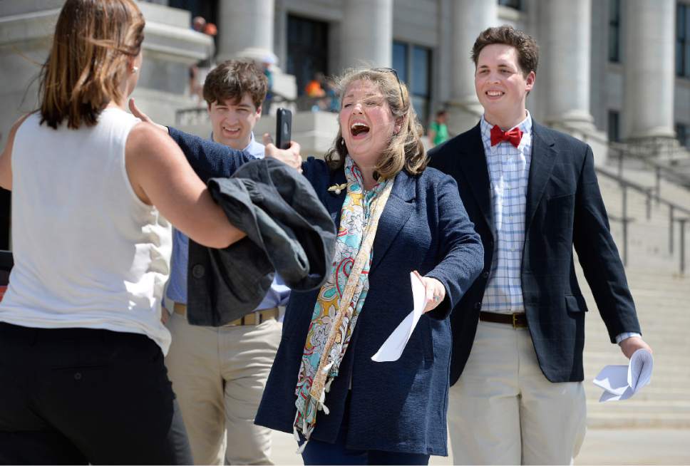 Scott Sommerdorf | The Salt Lake Tribune
Jacquelyn Orton runs to greet a friend and supporter after she finished her speech announcing her candidacy for the Legislature on the south side of the Utah Capitol, Wednesday, May 31, 2017. She will be running for the District 24 seat in the Utah House of Representatives.