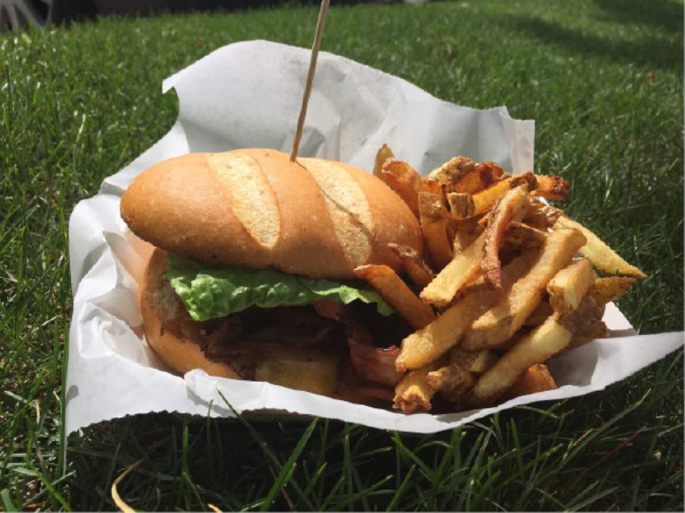 Kathy Stephenson  |  The Salt Lake Tribune


The Whiskey-Tango-Foxtrot burger with Semper Fries from Special Courses, a military themed food truck.