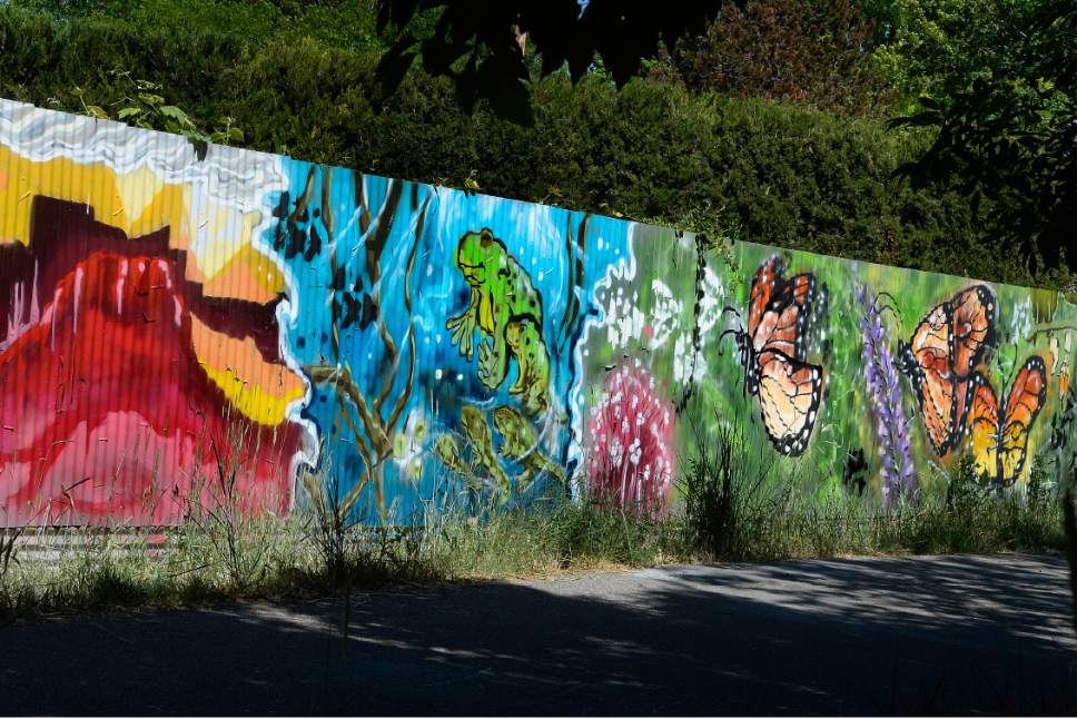 Scott Sommerdorf | The Salt Lake Tribune
The panel stretches for about 50 yards and contains art that local artists with Justified Ink and Glendale Middle School students installed on a length of fence next to the Jordan Parkway Trail, Friday, June 2, 2017.