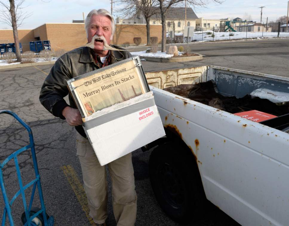 Al Hartmann  | Tribune file photo
After four terms (16 years) Dan Snarr with his signature handlebar mustache is leaving his post as mayor of Murray.  He loads up keepsakes from his office into his ancient, rusted out Chevy S-10 truck at Murray City Hall December 31, 2013.