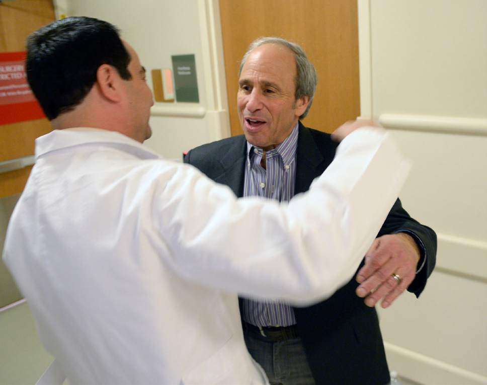 Al Hartmann  |  The Salt Lake Tribune
Dr. Jonathan Tward, MD, Phd Radiation Oncology, left, hugs former patient Tommy Tanzer outisde the MRI suite at Huntsman Cancer Institute.  Tanzer had prostate cancer three years ago and underwent three coventional biopsies without finding the source of the cancer.  Using the new technique of using an MRI and needle they were able to find the specific spot of the cancer and treat it.    Huntsman is using the new biopsy tool for patients with prostate cancer that is more accurate than previous forms.
A standard biopsy takes samples from 12 random spots hoping to find cancers, whereas this new method using an MRI and needle finds a precise point to take the biopsy with results that are much more accurate.