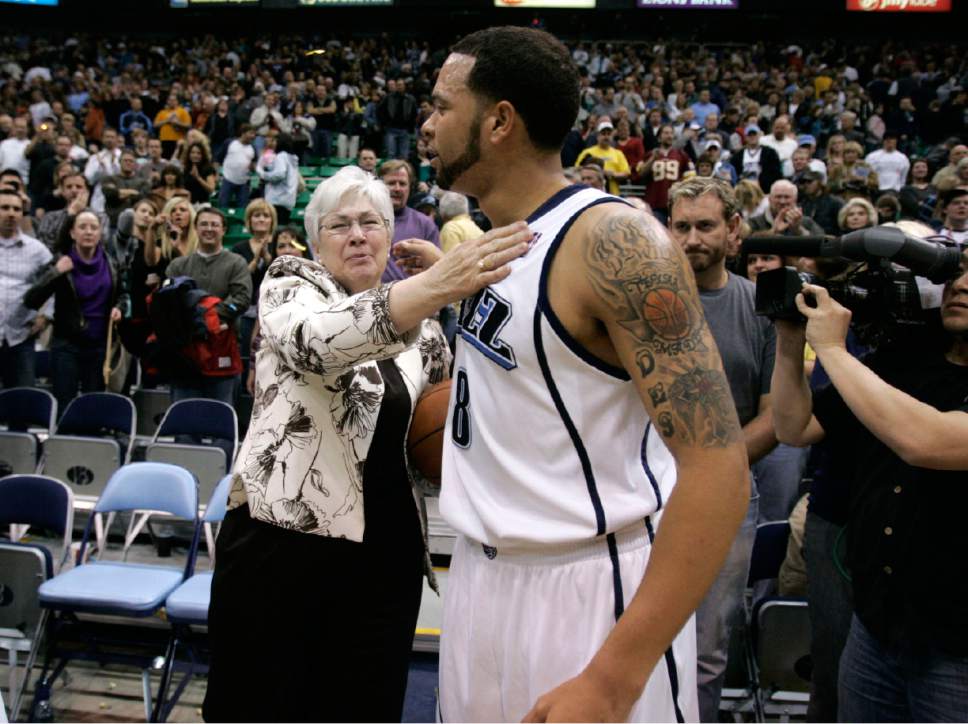 Utah Jazz guard Deron Williams (8) presents Gail Miller with the ball after their game against New Orleans Saturday, February 21, 2009 at EnergySolutions Arena in Salt Lake City.  Gail's husband Larry H. Miller passed away the day before from complications from Type 2 Diabetes. The Jazz defeated the Hornets 102 to 88. Jim Urquhart/The Salt Lake Tribune; 2/21/09