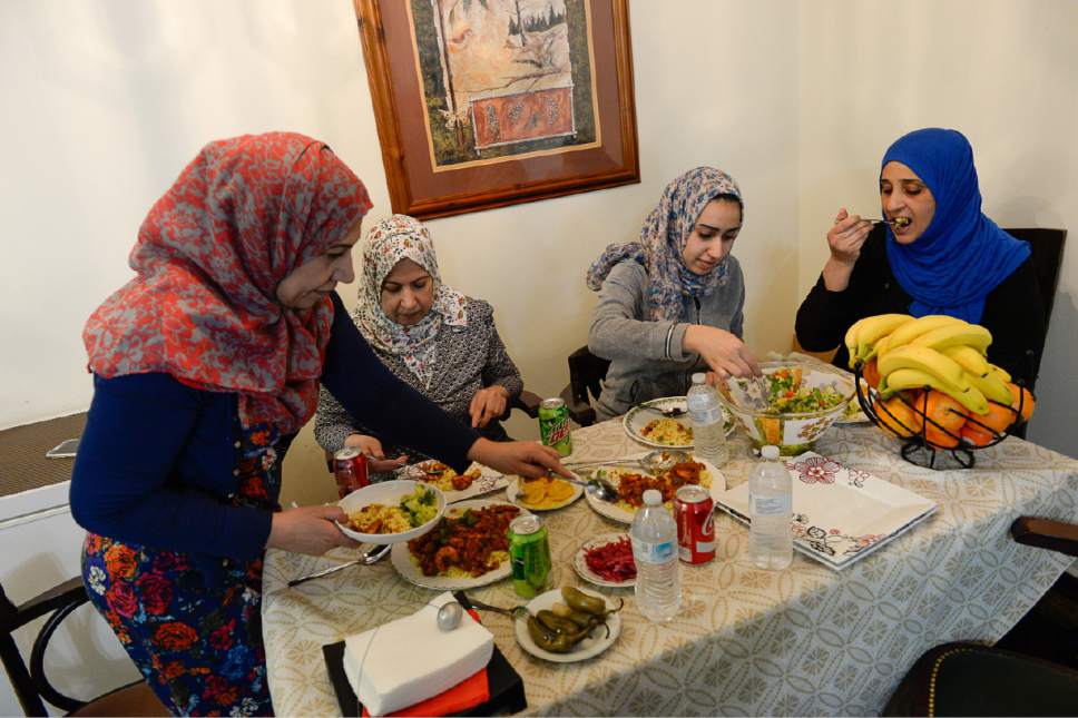 Francisco Kjolseth | The Salt Lake Tribune
THIS IS the first in a series of 4 stories where refugees cook a meal from their home country and talk about their culture.
mother - Iman Alshraheb
daughter - Baidaa Alshraheb
Friend's name is Wafaa  Abdraba
the dish is Magbus Rabyan