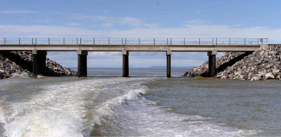 Al Hartmann  |  The Salt Lake Tribune
Water flows around the new, wider breach in the causeway that separates the north and south arms of the Great Salt Lake.