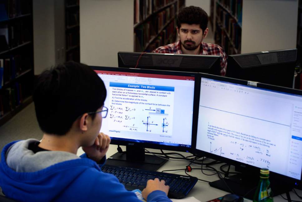 Scott Sommerdorf | The Salt Lake Tribune
Physics student Qixiang Chao, foreground, studies in the Marriott Library at the University of Utah, 2017.