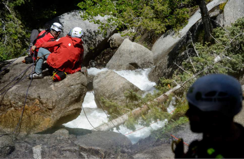 Steve Griffin  |  The Salt Lake Tribune



As the Bell Canyon waterfall tumbles down a rock cliff Salt Lake County Search and Rescue crews secure themselves as they work to free the body of 22-year-old Siaosi Brown after he fell into the runoff-swollen waters of Bell Canyon Creek Sunday evening. Crews called of the rescue efforts as high water levels prevented them from free the body in Salt Lake City Monday June 5, 2017.