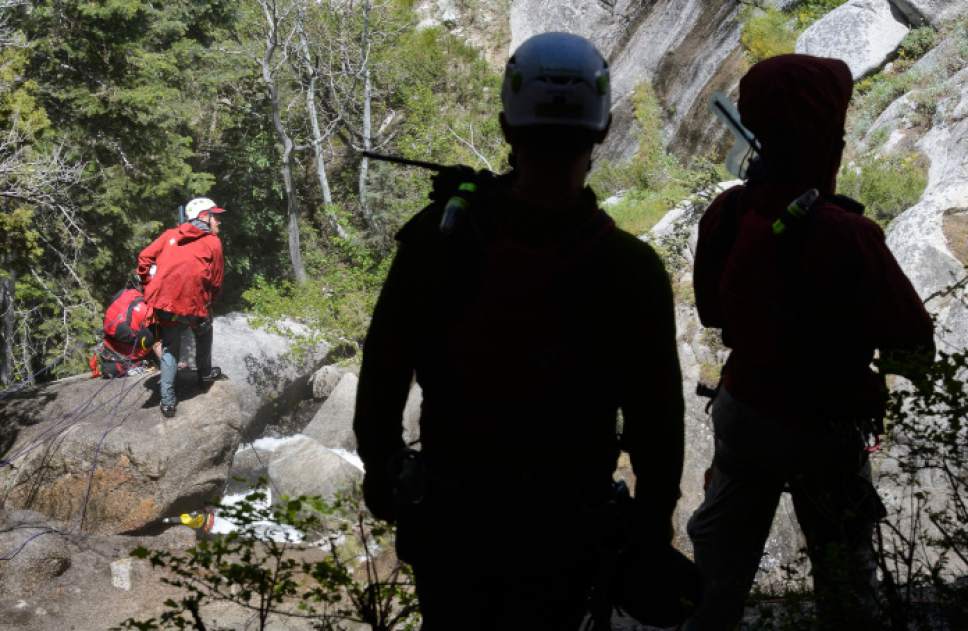 Steve Griffin  |  The Salt Lake Tribune



As the Bell Canyon waterfall tumbles down a rock cliff Salt Lake County Search and Rescue crews secure themselves as they work to free the body of 22-year-old Siaosi Brown after he fell into the runoff-swollen waters of Bell Canyon Creek Sunday evening. Crews called of the rescue efforts as high water levels prevented them from free the body in Salt Lake City Monday June 5, 2017.