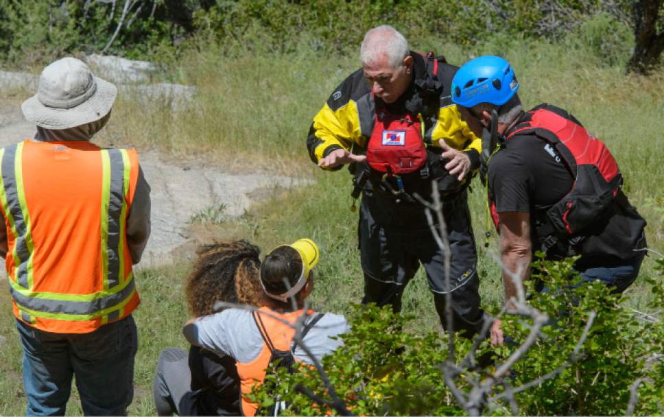 Steve Griffin  |  The Salt Lake Tribune


Salt Lake County Search and Rescue crews talk with family members of 22-year-old Siaosi Brown during a recovery effort for Brown's body after he fell into the runoff-swollen waters of Bell Canyon Creek Sunday evening. Crews called of the rescue efforts as high water levels prevented them from free the body in Salt Lake City Monday June 5, 2017.